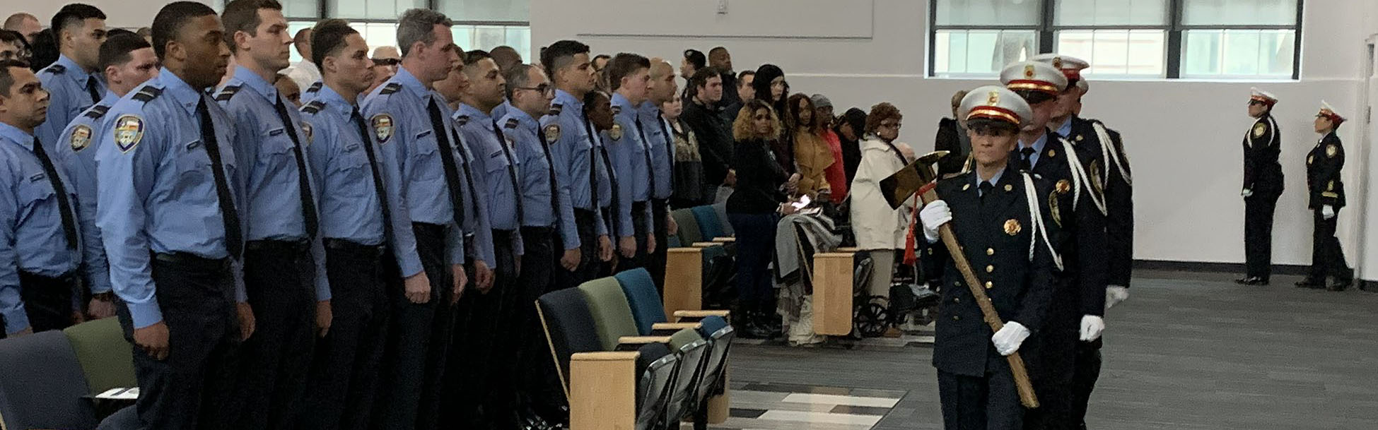 taking the oath of office in theater seating area with HFD Honor Gaurd lined infront by stage.