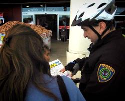 Officers distributing crime prevention flyers
